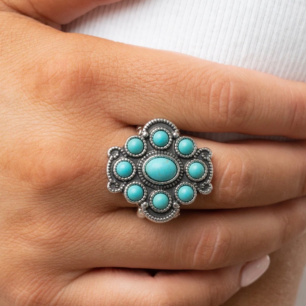 New in packaging turquoise and silver stretchy ring- Paparazzi